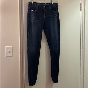 Dark blue distressed stretchy skinny jeans